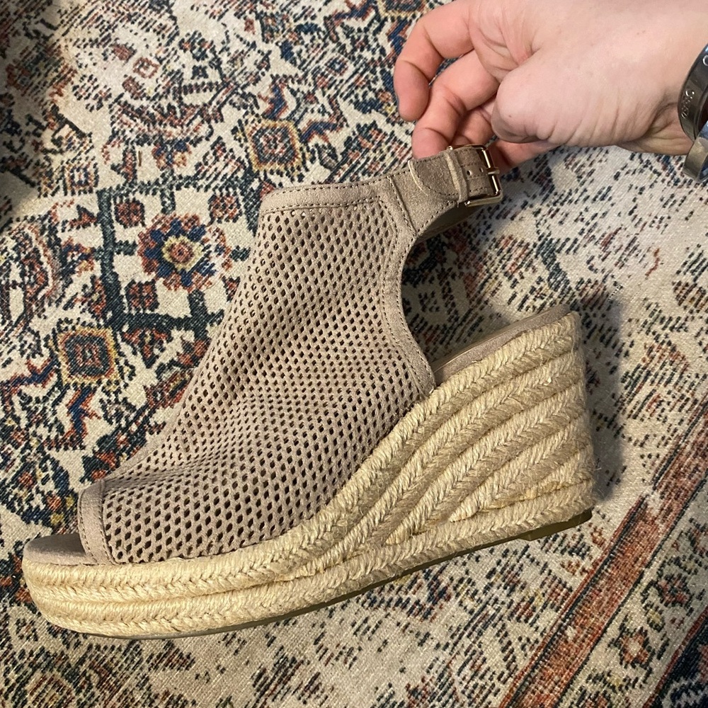 Never worn, size 8 1/2 beige wedges.
